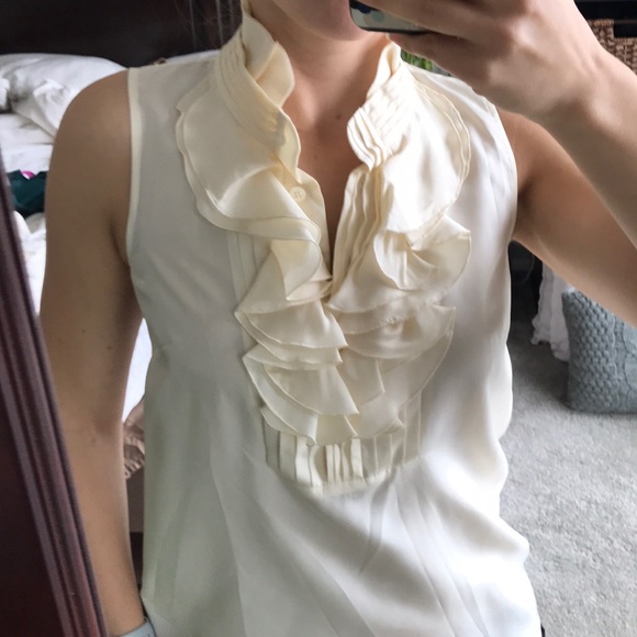 cream frilly blouse
